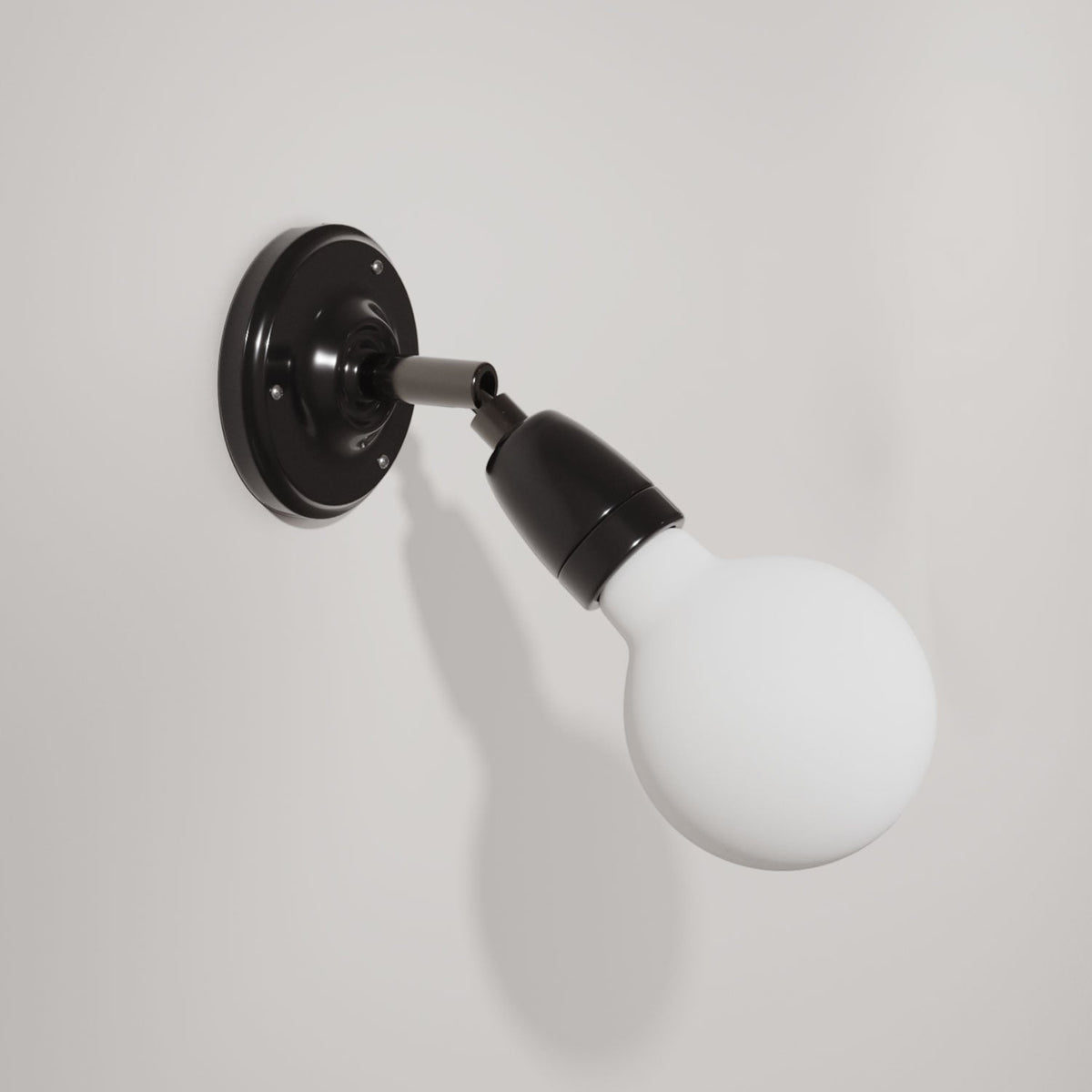 Fermaluce 90° Color, il punto luce orientabile in porcellana da parete o soffitto - Nero